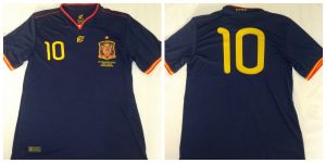 Camiseta conmemorativa del 10º aniversario del mundial 2010 por delante y por detrás: Ravelo.